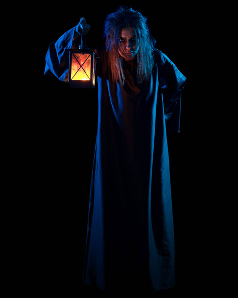 Scary witch isolated on black - 写真・画像