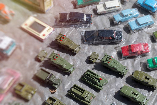 old children's toy cars and tanks at the flea market - Photo, Image
