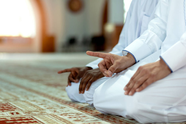 Muslim men praying with holy books in mosque - Foto, Imagem