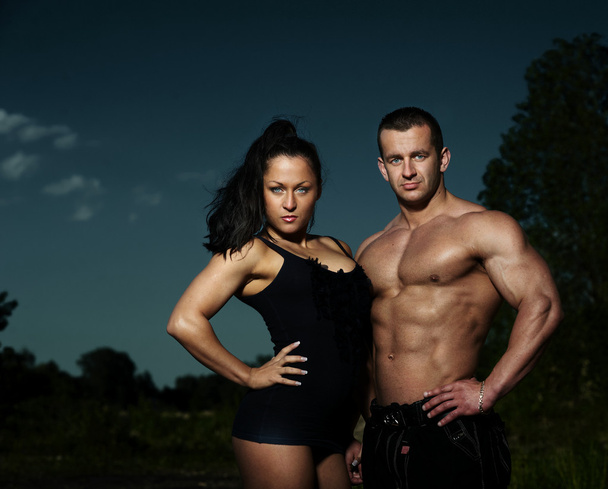 Athletic man and woman outdoors - Φωτογραφία, εικόνα