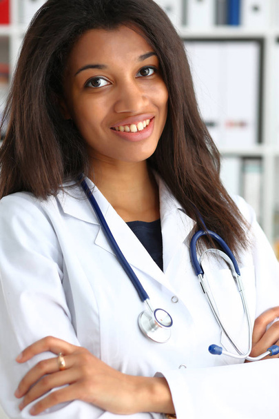 Beautiful black smiling female doctor portrait - Fotó, kép