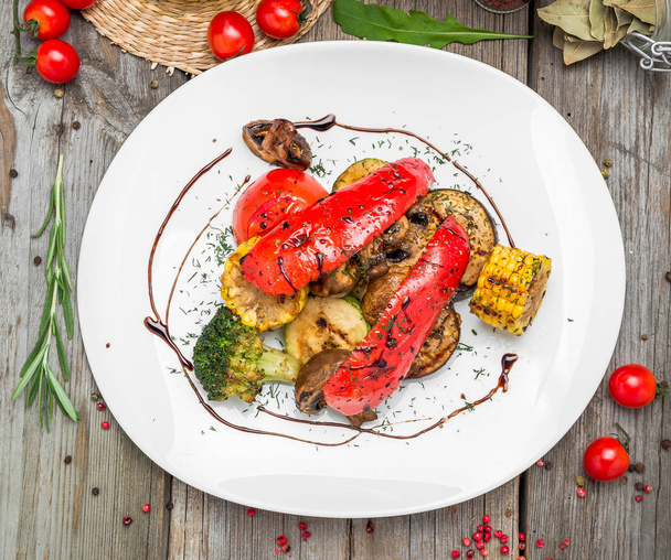 Grilled vegetables on a plate with sauce. - Photo, Image