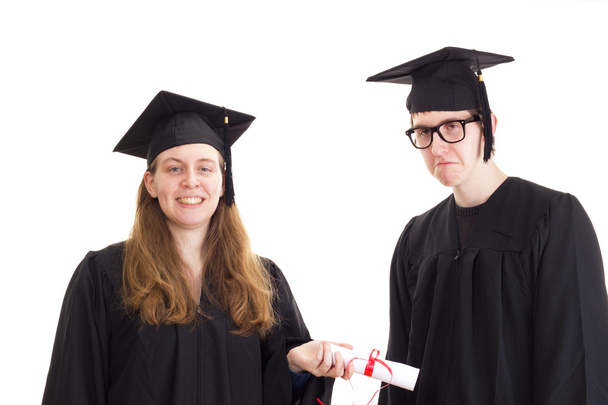 Двоє випускників у своїх академічних сукнях
 - Фото, зображення