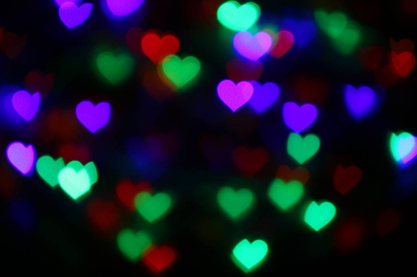 San Valentino colorato bokeh a forma di cuore su sfondo nero illuminazione bokeh per la decorazione di notte sfondo carta da parati sfocatura San Valentino, Amore Immagini di sfondo, Illuminazione a forma di cuore morbida notte astratta
 - Foto, immagini