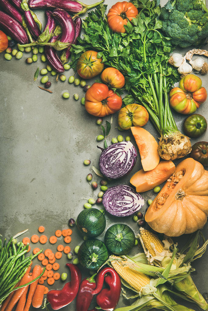 Healthy vegetarian seasonal Fall food cooking background. Autumn vegetables and herb over grey concrete background - 写真・画像
