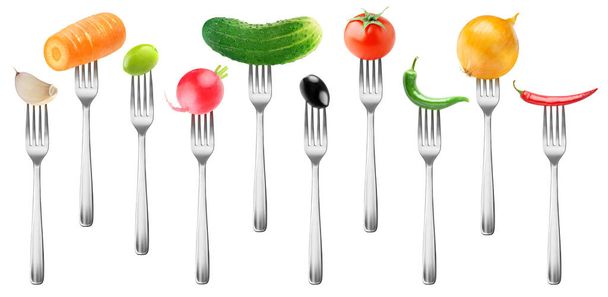 Isolated vegetables collection. Tomato, cucumber, garlic, carrot, olives, radish, peppers and onion on forks isolated on white background with clipping path - Photo, Image