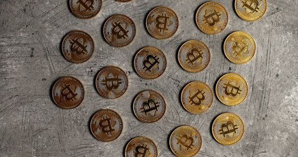 Golden bitcoins on gray surface - Photo, Image