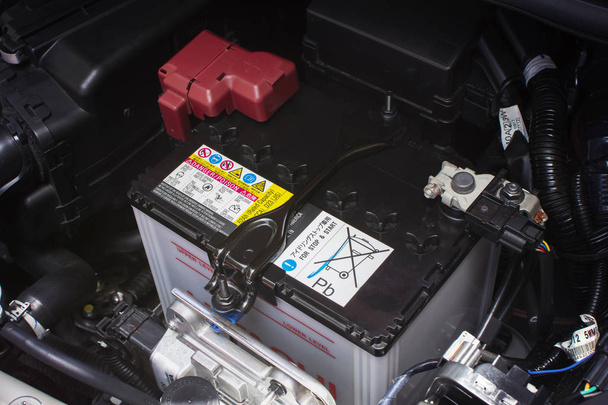 Car battery rechargeable for electrical system of eco car, automotive part concept. - Photo, Image