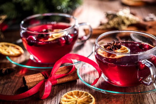 Two glasses of hot mulled wine with christmas decoration - Foto, imagen
