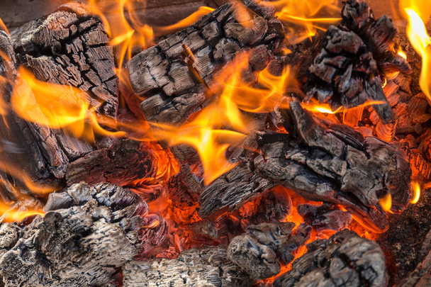burning fire and wooden coals close up - Photo, Image