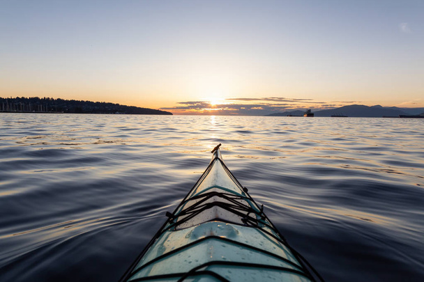 Sea Kayaking during a vibrant sunny summer sunset. Taken in Vancouver, BC, Canada. - Fotó, kép
