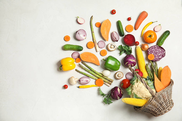 Flat lay composition with fresh vegetables on light background - Photo, Image