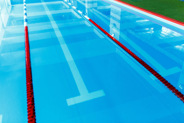Picture from top of swimming pool with blue and white, red dividers - 写真・画像