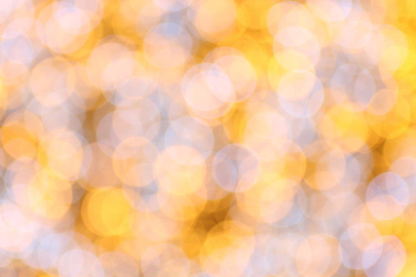Bokeh background gold yellow colorful of merry christmas, Happy new year bokeh lighting shine on night background, Bokeh glitter light, Golden Luxury backdrop texture, Glittering wallpaper - Photo, image