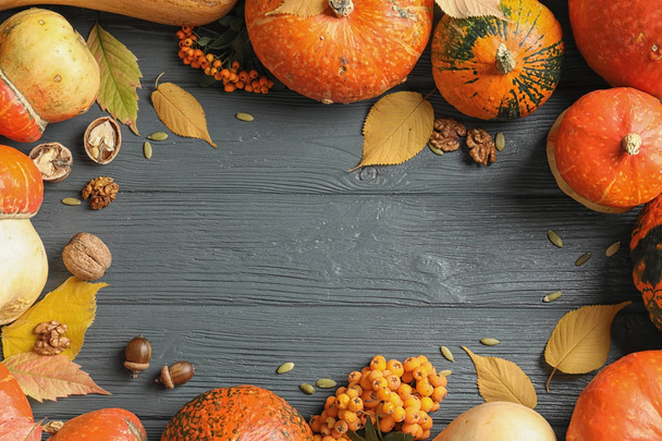 Orange pumpkins on wooden background, flat lay composition with space for text. Autumn holidays - Fotoğraf, Görsel