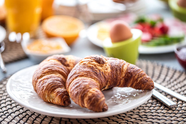 Breakfast served with coffee, orange juice and croissants - Fotografie, Obrázek