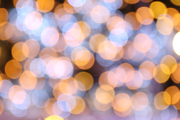 Bokeh arany háttér sárga, boldog karácsonyt, boldog új évet bokeh világítás fényét a éjszakai háttér, Bokeh csillogó fény, a luxus arany háttér textúra tapéta csillogó színes - Fotó, kép