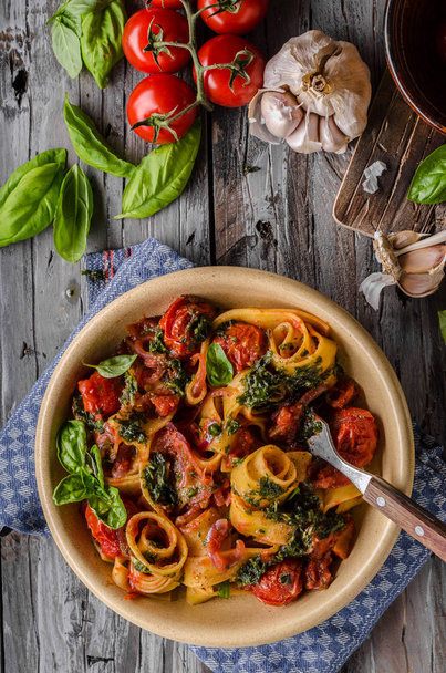 Tomato pasta basil on wood vintage board, fresh herbs and cheese in - Foto, Imagen