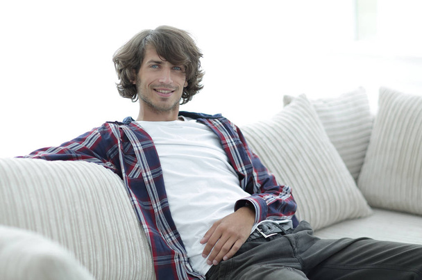 handsome successful guy resting on the couch. - Foto, immagini