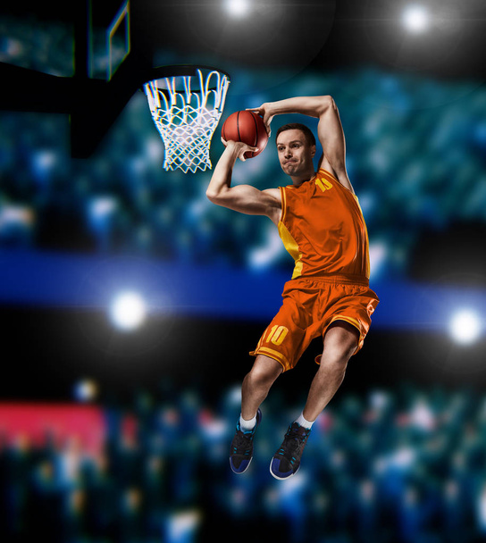 basketball player making slam dunk on basketball arena - Photo, Image