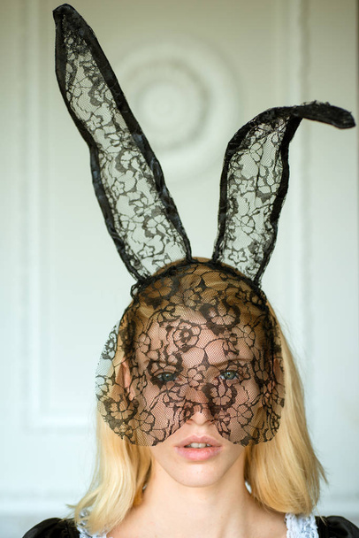 Girl wearing bunny ears on Easter day. Fashion portrait of beautiful sensual woman and looks very sensually. Surprise woman. Bunny rabbit. - Foto, afbeelding