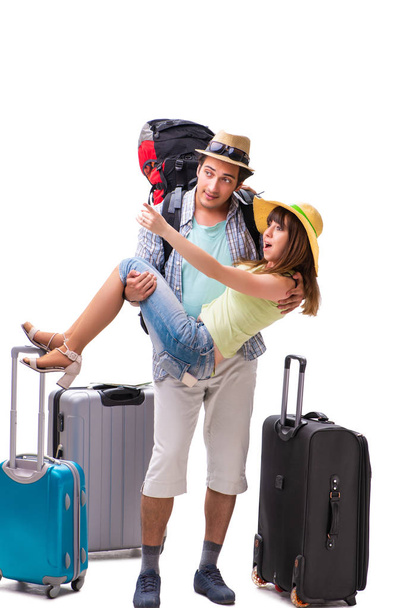Young family preparing for vacation travel on white - Foto, imagen