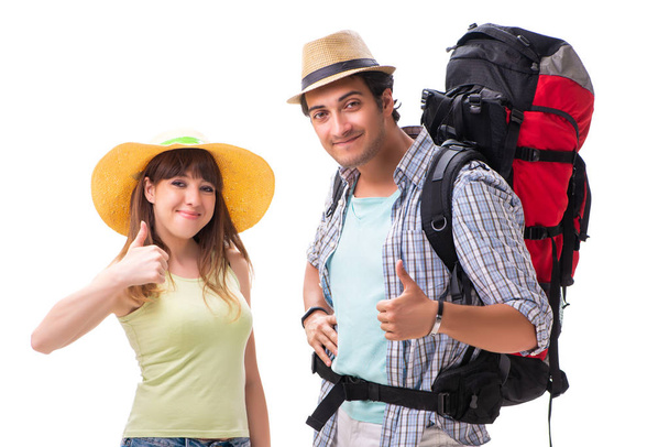 Νεαρή οικογένεια ετοιμάζεται για ταξίδια διακοπών σε λευκό - Φωτογραφία, εικόνα