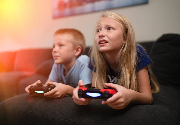 Children playing video games  - Fotó, kép