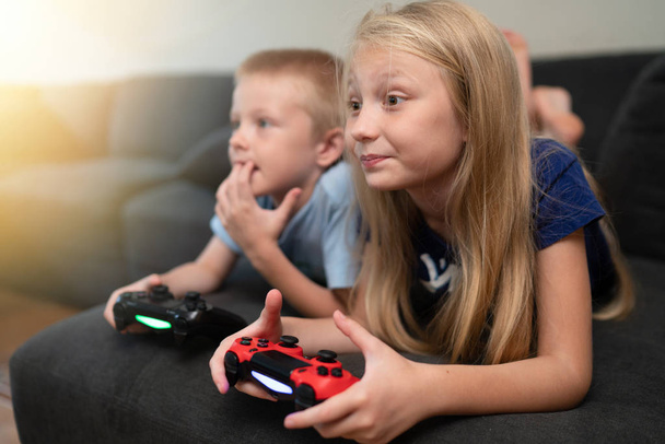 Children playing video games  - Foto, imagen
