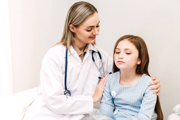 Doctor consulting and consulting with little girl in hospital.A little girl has sick.healthcare and medicine - Фото, изображение