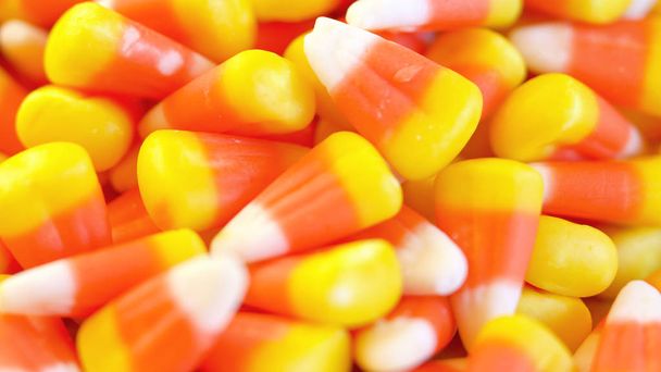 Macro closeup of Halloween traditional Candy Corn treats. - Photo, Image