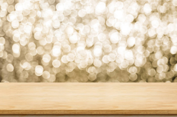 Empty old rustic wood table top with blur sparkling gold bokeh abstract background,panoramic banner for display or montage of product,Holiday seasonal concept backdrop - 写真・画像