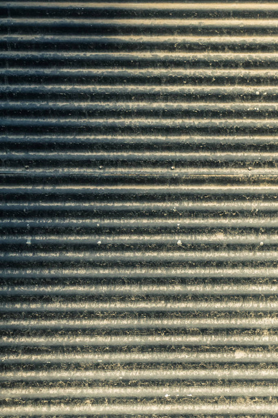 Straight lines on a shop front shutter as a metal background - Photo, Image