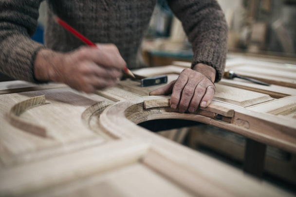 Close up shot of old master carpenter working in his woodwork or workshop - Fotoğraf, Görsel