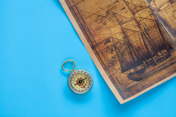 Vintage Compass and old sea map on color background. - Foto, imagen