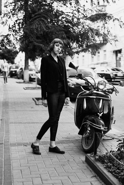 Young short haired woman in stylish black clothes posing               - Fotografie, Obrázek