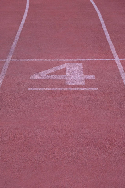 Red treadmill with white markings. Track running at the stadium - Photo, Image