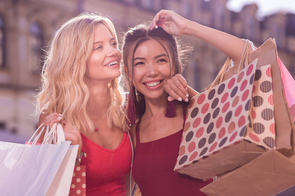 Nice joyful women feeling happy after shopping - Foto, Imagem