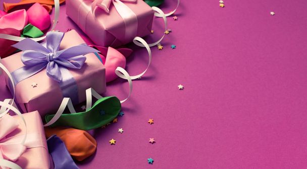 Banner Festive background of purple material colorful balloons streamers confetti. Top view flat lay copy space - Photo, Image