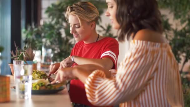 female friends eating at restaurant - Πλάνα, βίντεο