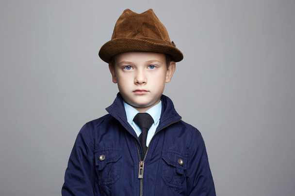 fashionable little boy in hat. fashion child portrait. elegant kid in tie, business child - Valokuva, kuva