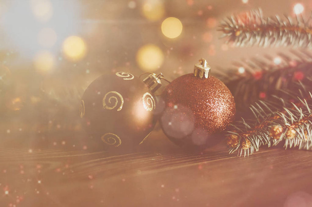 Brown Christmas balls on Christmas tree background - Foto, Imagen