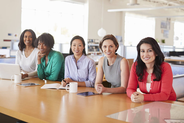 Female business colleagues in office smiling at camera - Foto, Bild