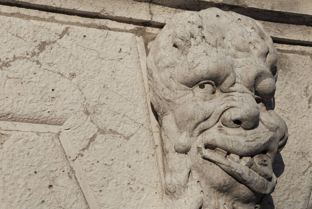 Grotesque in Venice. Bizarre monster guardian head on Santa Formosa Church bell tower (17th century) - Photo, Image