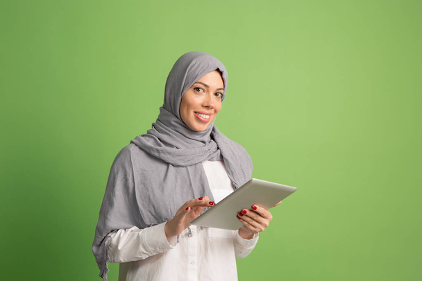 Happy arab woman in hijab. Portrait of smiling girl, posing at studio background - Photo, image