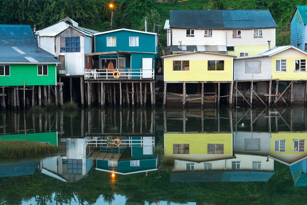 Traditional stilt houses know as palafitos in the city of Castro at Chiloe Island in Southern Chile - Photo, Image