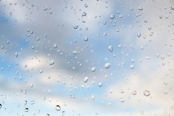 raindrops on window glass on background of cloudy sky - Photo, Image