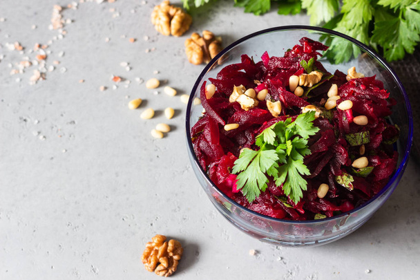 Healthy vegan beetroot salad with nuts and herbs.  - Fotoğraf, Görsel