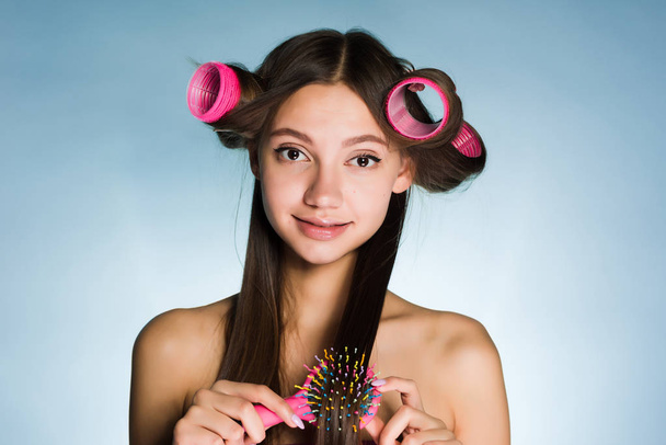 charming young girl with long hair going to a party, wants a beautiful hairstyle - 写真・画像