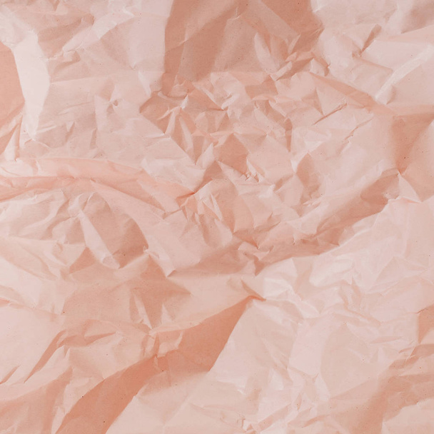 Pastel peachy crumpled paper texture. - Valokuva, kuva
